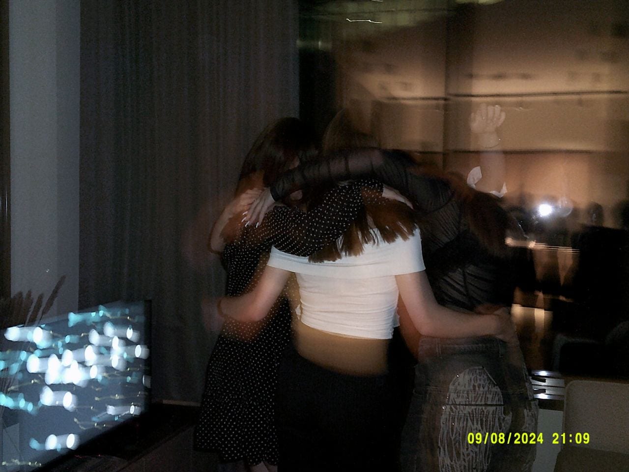 A blurred hug that nobody posed for